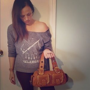 Michael Kors barrel bag.